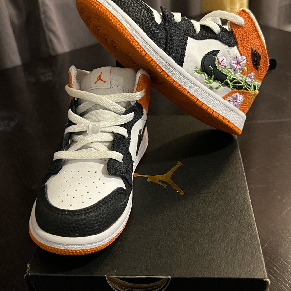 Jordan Kids' Black, White, and Orange Floral Sneakers